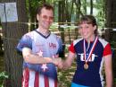 Lori Huberman receives her W21 category 2 meter gold medal from championships organizer Vadim Afonkin, KB1RLI. Lori is one of the New England Orienteering Club members who learned all about ARDF from Vadim in the weeks prior to the championships.